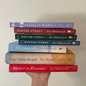 Collection of books from Elin Hilderbrand and one from Riley Costello